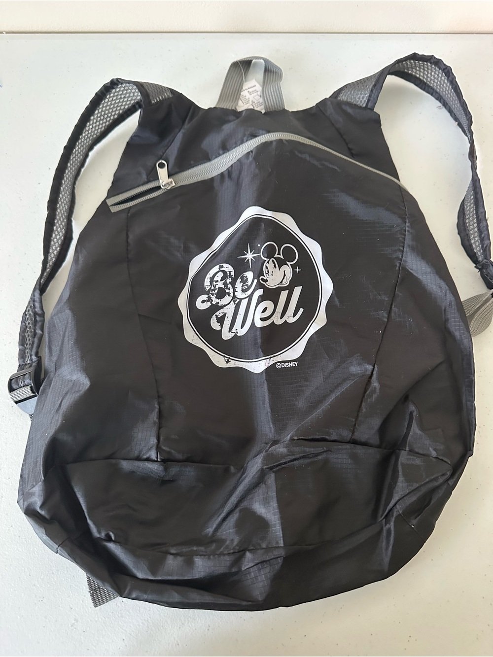 Disney Black 'Be Well' Foldable Backpack with White Logo NWT